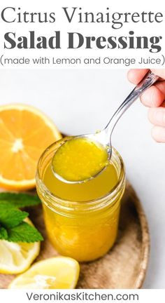 a spoon full of lemon and orange juice with the words citrus vinaigreate salad dressing