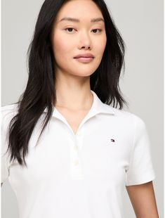 Tommy Hilfiger women's polo. Our classic polo is a key part of the Hilfiger heritage—as relevant today as is was in 1985. This version is cut from stretch cotton for comfort and ease of movement.  Material: 97% Regenerative Cotton, 3% Elastane. Casual Fitted Tommy Hilfiger Polo Shirt, Fitted Tommy Hilfiger Casual Polo Shirt, Classic Tommy Hilfiger Collared Polo Shirt, Fitted Tommy Hilfiger Polo Collar Top, Classic Tommy Hilfiger Collared Tops, Tommy Hilfiger Women, Cotton Polo, Stretch Cotton, Tommy Hilfiger