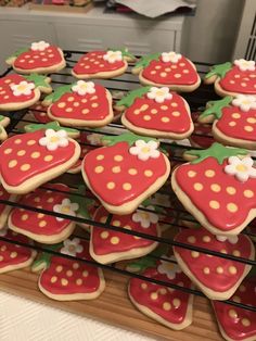 strawberry cookies are arranged on a cooling rack