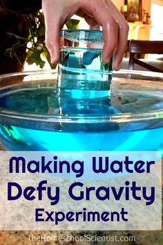 someone is dipping something into a bowl with blue liquid in it and the words making water defy gravity experiment