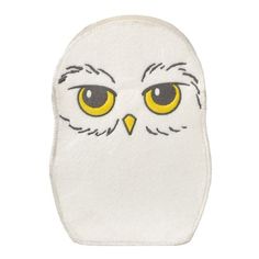 an owl face with yellow eyes on a white background