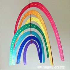 a rainbow mobile hanging from a string