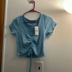 Pacsun Short Sleeve Crop Top, Never Worn. Size S Trendy Blue Summer Tops, Casual Crop Top For Spring, Light Blue Summer Tops For Vacation, Casual Spring Crop Top, Casual Blue Summer Top, Casual Blue Tops For Summer, Light Blue Summer Vacation Tops, Casual Short Sleeve Crop Top For Beach, Casual Blue V-neck Crop Top