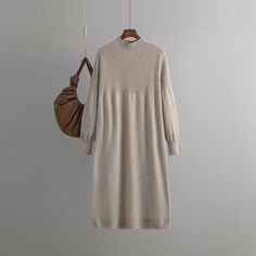 Elevate your autumn and winter style with our Loose Mid-Length Bottoming Knitted Dress. This versatile dress features a V-neck, long sleeves, and a loose silhouette, providing both warmth and fashion-forward flair.Crafted from high-quality woolen fabric, this dress ensures comfort and insulation during colder seasons. The loose fit allows for easy movement, making it an ideal choice for various occasions. The mid-length design adds a touch of modesty and sophistication.The V-neck and long sleeves create a classic and timeless look, making this dress suitable for both casual outings and more dressed-up affairs. Pair it with your favorite boots or heels for a chic and stylish ensemble that embraces both warmth and fashion.Step into autumn and winter with confidence. Our Loose V-neck Knitted Turtleneck Pattern, Oversized Knitted Sweaters, Knitted Dress, Daily Dress, Versatile Dresses, Knit Sweater Dress, Social Events, Winter Style, Chic Dress