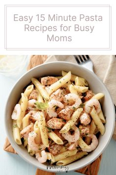 pasta with shrimp and sauce in a white bowl