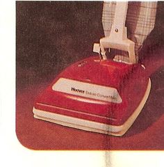 a red and white floor sander sitting on top of a table