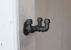 a close up of a faucet on a wall