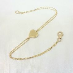 -The heart bracelet is made with high quality 14K real solid gold. The size of the heart is 8mm X 8mm. There is double chain. - This tiny, dainty, charm, delicate and trendy bracelet has been artfully designed for timeless yet modern millennial fashion. - You receive the bracelet in a beautiful and free gift box. - The bracelet length is 7 inches. We can shorten it. just write on personelized ares. - Free shipping (Arrive within 4 business days to USA and Canada ( 1 day for production + 3 days f Yellow Gold Charm Bracelet With Heart For Anniversary, Classic Heart Chain Bracelet For Valentine's Day, Classic Heart-shaped Chain Bracelet For Valentine's Day, 14k Yellow Gold Charm Bracelet With Heart Charm, Classic Yellow Gold Heart Charm Bracelet, 14k Rose Gold Bracelet For Valentine's Day, 14k Gold Yellow Gold Charm Bracelet With Heart Charm, 14k Yellow Gold Chain Bracelet With Heart Charm, Elegant 14k Gold Bracelets For Valentine's Day