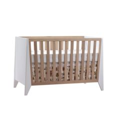 a wooden crib with white sheets on the bottom and side panels, in front of a white background