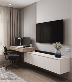 a room with a desk, chair and television on the wall in front of a window