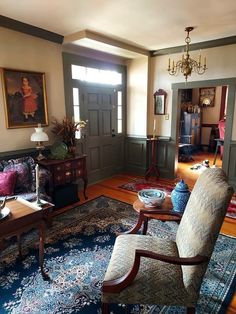 a living room filled with furniture and rugs