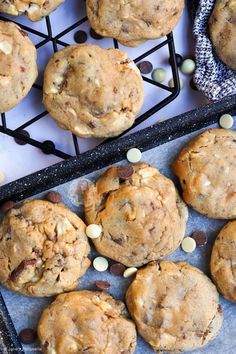 chocolate chip cookies and white chocolate chips on a cooling rack