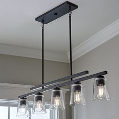 a light fixture with five lights hanging from it