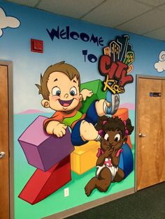 the children's room is decorated with colorful murals and cartoon characters on the walls