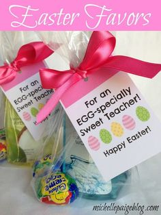 an easter treat bag with eggs and candy in it, tied to a pink ribbon