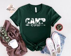 Camping Crew Shirt, Field Trip T-shirt, Friends Camping Shirt, Family Camping Shirt, Camp Life Gift Tee, Cute Gift for Campers, Gift for Her Dear Customer, We're here to give you the best shirt options for you. We want to make everyone smile with our cute, stylish, and trendy graphic T-shirts. We can assure you this shirt will be the perfect gift whether you will buy it yourself or for someone else. We are using great quality soft style Shirts For You. IMPORTANT Check the size chart before you purchase HOW TO MAKE AN ORDER * Pick your shirt type and size Your design will be printed on the front. *Pick your t-shirt color Add your design Name If Your Order Customized PRODUCTION Processing time is 1-3 business days. For rush orders please contact us first. SHIPPING Domestic Shipping First Cla Cotton T-shirt With Letter Print For Camping, Green Crew Neck Top For Camping, Pre-shrunk Green T-shirt For Camping, Green Letter Print T-shirt For Outdoor Activities, Green T-shirt With Letter Print For Outdoor Activities, Green T-shirt With Letter Print For Outdoors, Casual T-shirt For Camping, Green Pre-shrunk T-shirt For Camping, Green Graphic Tee For Camping