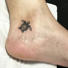 a small turtle tattoo on the ankle