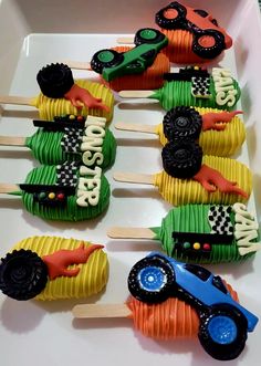 cupcakes decorated like cars and trucks on sticks