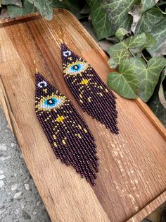 Purple evil eye beaded fringe earrings seed bead earrings dangle boho earrings chandelier earrings native bead earrings evening earrings ♥𝑇ℎ𝑒 𝑝𝑎𝑡𝑡𝑒𝑟𝑛 𝑜𝑓 𝑡ℎ𝑖𝑠 𝑒𝑎𝑟𝑟𝑖𝑛𝑔 𝑖𝑠 𝑐𝑟𝑒𝑎𝑡𝑒𝑑 𝑏𝑦 𝐾𝑎𝑍𝑒𝐵𝑒𝑎𝑑𝐽𝑒𝑤𝑒𝑙𝑟𝑦 ♥𝑀𝑎𝑑𝑒 𝑢𝑠𝑖𝑛𝑔 𝑓𝑟𝑒𝑒ℎ𝑎𝑛𝑑 𝑏𝑒𝑎𝑑𝑖𝑛𝑔 𝑤𝑜𝑣𝑒𝑛 𝑡𝑒𝑐ℎ𝑛𝑖𝑞𝑢𝑒𝑠 𝑤𝑖𝑡ℎ 𝑠𝑡𝑟𝑜𝑛𝑔 𝑠𝑦𝑛𝑡ℎ𝑒𝑡𝑖𝑐 𝑡ℎ𝑟𝑒𝑎𝑑. ♥𝑇ℎ𝑒 𝑠𝑖𝑧𝑒 𝑜𝑓 𝑡ℎ𝑒 𝑠𝑒𝑒𝑑 𝑏𝑒𝑎𝑑𝑠 𝑢𝑠𝑒𝑑 𝑖𝑠 2 𝑚𝑖𝑙𝑙𝑖𝑚𝑒𝑡𝑒𝑟𝑠 𝑎𝑛𝑑 𝑏𝑒𝑎𝑑𝑠 𝑎𝑟𝑒 ℎ𝑖𝑔ℎ 𝑞𝑢𝑎𝑙𝑖𝑓𝑖𝑒𝑑. ♥𝐴𝑙𝑙 𝑡ℎ𝑒 ℎ𝑜𝑜𝑘𝑠 𝑢𝑠𝑒𝑑 𝑖𝑛 𝑜𝑢𝑟 𝑗𝑒𝑤𝑒𝑙𝑟𝑦 𝑎𝑟𝑒 24 𝑘 𝑔𝑜𝑙𝑑 𝑝𝑙𝑎𝑡𝑒𝑑 𝑎𝑛𝑑 ℎ𝑦𝑝𝑜𝑎𝑙𝑙𝑒𝑟𝑔𝑒𝑛𝑖𝑐. ♥𝑇ℎ𝑒𝑠𝑒 𝑎𝑟𝑒 𝑣𝑒𝑟𝑦 𝑙𝑖𝑔ℎ𝑡 𝑒𝑎𝑟𝑟𝑖𝑛𝑔𝑠 𝑡ℎ𝑎𝑡 𝑦𝑜𝑢 𝑐𝑎𝑛 𝑤𝑒𝑎𝑟 𝑎𝑙𝑙 𝑑𝑎𝑦 𝑤𝑖𝑡ℎ𝑜𝑢𝑡 ℎ𝑢𝑟𝑡𝑖𝑛𝑔 𝑦𝑜𝑢𝑟 𝑒𝑎𝑟! The only Bohemian Evil Eye Dangle Jewelry, Purple Evil Eye, Evening Earrings, Beaded Fringe Earrings, Earrings Chandelier, Light Earrings, Beaded Fringe, Seed Bead Earrings, Fringe Earrings