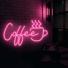 a neon sign that says coffee on it