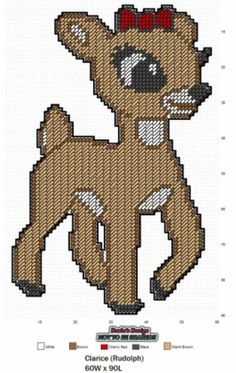 a cross stitch pattern of a dog with a bow on it's head