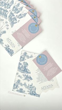 several pieces of paper with blue and white designs on them