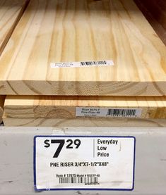 a close up of some wood with price tags on it