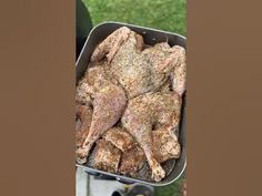 the chicken is being cooked on the grill outside in the yard, and ready to be eaten