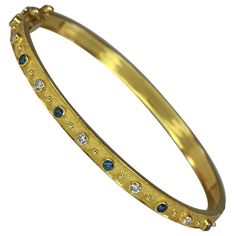 This is S.Georgios designer reversible bangle bracelet all hand made in Greece from 18 Karat yellow gold. The bracelet is microscopically decorated with granulation work in Byzantine style - the gold beads are each made and decorated by hand separately and one side is finished with a unique Black Rhodium velvet background. The Bracelet in total features 0.88 Carat of brilliant-cut white Diamonds. The bracelet closes with a 3-way secure clasp. It can also be custom-made in White or Rose Gold. All Velvet Background, Matching Rings, Black Rhodium, Blue Diamond, White Diamonds, Diamond Stone, Gold Beads, Estate Jewelry, Bangle Bracelet