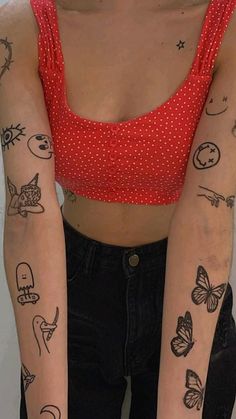 a woman with many tattoos on her arms