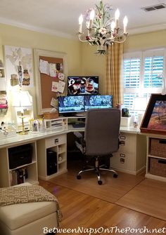 a home office with two computer screens on the desk and a chair in front of it