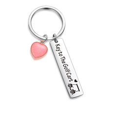 a key chain with a pink heart on it