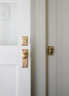 an open door with two knobs on it