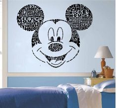 a mickey mouse wall decal with words written all over it