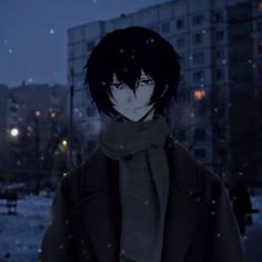 a man standing in the snow at night