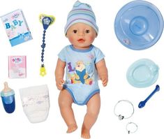 a baby doll is sitting next to its accessories