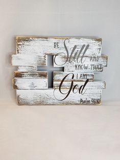 a wooden sign with the words, be still and know that i am god