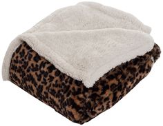 a leopard print blanket on top of a pillow