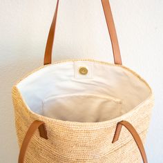 In Stock Fast Shipping From Los Angeles Chic large straw woven tote bag perfect for all occasions. This tote bag is sure to keep up with your busy lifestyle, providing a lightweight and durable design with a classic aesthetic. It’s the perfect way to stay organized while making a stylish statement. Natural Soft Raffia Straw Open top with magnetic button closureFully linedPocket insideMaterial: 100% RaffiaGenuine leather handles Size approximately 12.5"H x 15"W x 7.5"D11" handle drop Designer Sty Beige Straw Beach Bag For Everyday Use, Beige Bucket Bag With Rolled Handles For Travel, Natural Bags With Rolled Handles For Vacation, Natural Color Bags With Rolled Handles For Vacation, Everyday Woven Natural Fiber Bag, Everyday Straw Shoulder Bucket Bag, Everyday Beach Bag With Leather Handles And Jute Material, Everyday Straw Shoulder Beach Bag, Everyday Straw Bucket Shoulder Bag