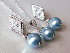 Wedding Light Blue Blush Baby Blue Colored Pearl Silver Earrings and Necklace Bridal Jewelry Set with .925 Sterling Silver Chain. CHAIN is 18 inches (45.7cm) long. EARRINGS are about 1.18 inch (3cm) long from top of earring stud to bottom. PENDANT is about 0.90 inch (2.3cm) long including bail. BRIDAL BRACELET SECTION: https://www.etsy.com/shop/LanaChayka?ref=seller-platform-mcnav§ion_id=11638942 BRIDAL EARRINGS SECTION: https://www.etsy.com/shop/LanaChayka?ref=seller-platform-mcnav§ion_id=11638 Blue Teardrop Jewelry For Wedding, Blue Round Bridal Earrings For Formal Occasions, Blue Teardrop Wedding Jewelry, Blue Pearl Drop Bridal Earrings As Gift, Blue Pearl Drop Bridal Earrings For Wedding, Blue Round Jewelry Sets For Wedding, Blue Pearl Drop Jewelry For Gift, Elegant Blue Bridal Earrings For Wedding, Blue Pearl Drop Jewelry For Wedding