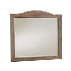 a wooden framed mirror on a white wall