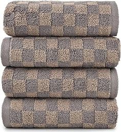 three towels stacked on top of each other in brown and white checkered pattern,