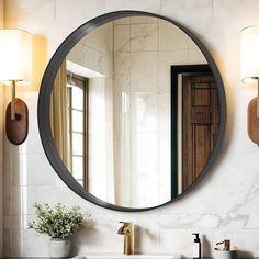 a bathroom sink under a round mirror in front of a wall mounted faucet