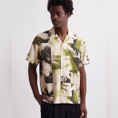 Saturdays Disco Print Canty Short Sleeve Shirt Classic Khaki New In Packaging. The Canty Shirt Is Our Classic Relaxed-Fit Camp Collar Shirt Cut In A Tencel-Rich Cotton Blend. The Disco Print Is Informed By Themes From Our Seasonal Story, Evoking The Celebratory Liberation Of Togetherness On Dance Floors. Open Camp Collar Button Closure Side Vent Detail On The Side Seam Standard Shirt Back Yoke Turn Back Clean Finished With Single Needle Topstitching At Sleeve Opening And Bottom Hem. Embroidered Green Camp Collar Top For Spring, Spring Green Tops With Camp Collar, Fitted Green Top With Camp Collar, Disco Print, Camp Collar Shirt, Dance Floors, Saturdays Nyc, Khaki Color, Collar Shirt