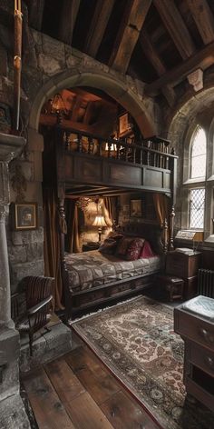 an old fashioned bedroom with a large bed in the center and lots of wood flooring