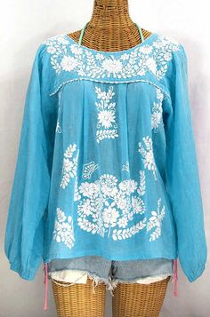 "* Ornate hand embroidery and elegant long sleeves with puff cuffs, available here in AQUA with WHITE embroidery. * Light, gauzy and semi-sheer 100% cotton throughout; wear it billowy and flowing in the traditional bohemian style. * Entirely hand dyed, distressed and embroidered for an authentic, retro-vintage and hippie casual vibe. * Our ornate butterfly floral embroidery patterns are a faithful tribute to the original Mexican style hippie blouses of the 1970's. * Caringly embroidered by hand, Mexican Clothes, Hippie Elegante, Mexican Peasant Blouse, Embroidery Light, Hippy Clothes, Hippie Blouse, Personal Things, Mexican Blouse, Floral Embroidery Patterns