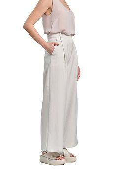 These Pleated Wide Leg Pants are perfect for the modern woman. Made from a blend of cotton, satin, and elastane, they offer a comfortable fit and a high waistline. The wide leg trousers add a touch of elegance to any outfit, whether it's for a casual day out or a formal work event. Pair them with your favorite top and accessories to create a chic and sophisticated look. High rise Slanted side pockets Full length Wide legs Hook-&-bar / zip fly Belt loops Material: 70% cotton 26% satin 4% elastane Pleated Wide Leg Pants, Wide Legs, Wide Leg Trousers, Mix Match, Modern Woman, Leg Pants, Wide Leg Pants, The Modern, Full Length