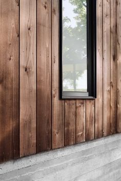 a window on the side of a wooden building