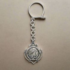 With this traditional Greek Macedonian Alexander the Great Motif you will never be lost. Handmade key ring in sterling silver. Sterling Silver Key Ring 100% the brightest of all precious metals Special secure design for the clasp so that your keys remain at all times at their place Greek key ring with fabulous detailing to the front and back  Handcrafted key ring. Forget the standardized products on the market! Stand out with our individually handmade ELEFTHERIOU EL key rings Made in Greece Alex Silver Keychain With Key Clip As Gift, Silver Keychain With Key Clip For Gift, Silver Metal Keychain As Gift, Silver Metal Keychains As Gifts, Silver Metal Keychain For Gift, Silver Keychain With Lobster Clasp As Gift, Silver Keychain With Lobster Clasp For Gift, Silver Key, Alexander The Great