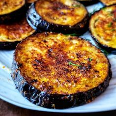 an eggplant dish on a plate with parsley